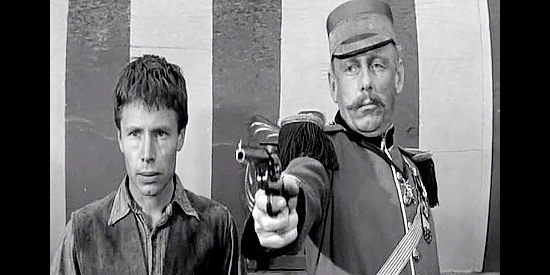 Tom Pittman as Carl, aka Flytrap, about to test his skill against Col. Applewait (John O'Mally) in Black Patch (1957)