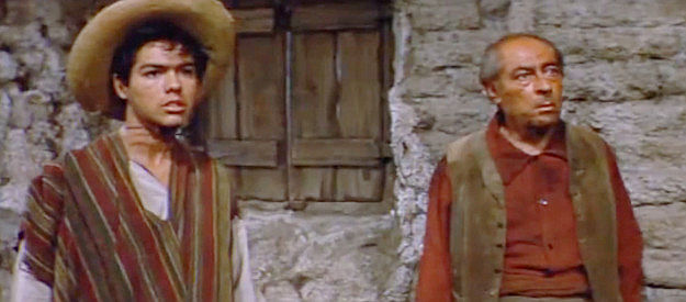 Tony Terry as Vincente Colton and Frank Puglia as Tio (Uncle) Perico, fearful because Maria is helping Trace Jordan in The Burning Hills (1956)