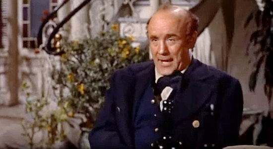 Torin Thatcher as Capt. Canavan, reminiscing about the days he and Hamish sailed the seas together in Band of Angels (1957)