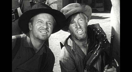 Two of Papa Clellan's boys taking orders from their father in Seven Guns to Mesa (1958)