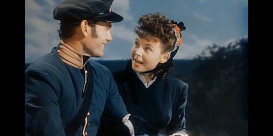 Valentine Perkins as Annette, Aleeta's maid, feeling safer in the custody of an Army officer in Rock Island Trail (1950)
