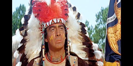 Victor Mature as Crazy Horse, donning the war bonnet of 'the chosen one' in Chief Crazy Horse (1955)