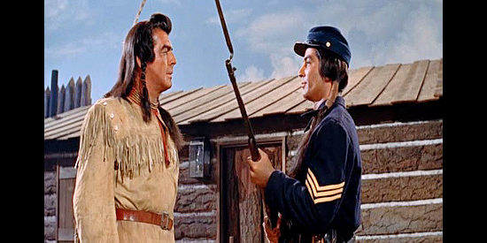 Victor Mature as Crazy Horse finds himself threatened with imprisonment by Little Big Man (Ray Danton) in Chief Crazy Horse (1955)