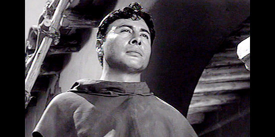 Victor Milan as Father Ignatius, who helps lawman Hamish find outlaw Kallen in The Ride Back (1957)