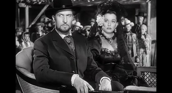 Vincent Price as Baron James Addison Reavis and Ellen Drew as his wife Sofia, feeling the wrath of Arizona land owners in The Baron of Arizona (1950)