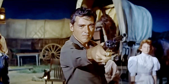 William Bishop as Capt. George Wayne, secretly heading West under government orders in The Oregon Trail (1959)