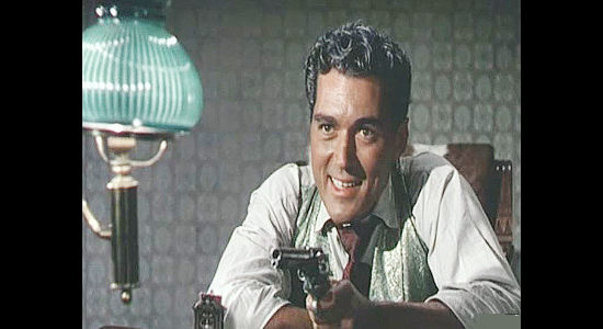 William Bishop as Silver Kirby, using a game of Russian roulette to find out who his enemies are in Cripple Creek (1952)