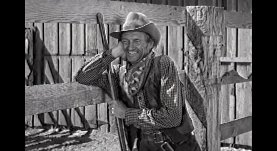 William Fawcett as Alkali, the man who helped raise Queenie Hart, watching her fall for a man in Cattle Queen (1951)