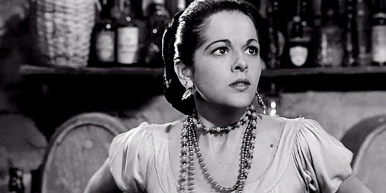 Yvettte Duguay as Rosita, frightened by a brute while working in the cantina in The Domino Kid (1957)
