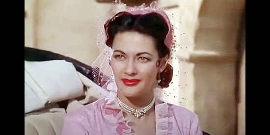 Yvonne De Carlo as Carmelita Carjas, a woman who believes in wealth, not lost causes in Border River (1954)