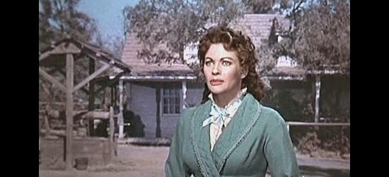 Yvonne De Carlo as Hannah Montgomery, greeting a stranger to her husband's ranch in Raw Edge (1956)