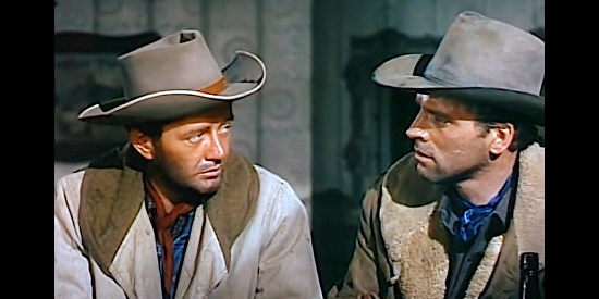 Robert Walker as Lee Strobie and Burt Lancaster as Owen Daybright, discussing Lee's newly born problem in Vengeance Valley (1951)