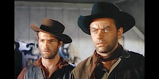 Hugh O'Brian as Dick Fasken and John Ireland as Hub Fasken, determined to defend their soiled sister's honor in Vengeance Valley (1951)