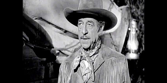 Al Bridge as Conover, the wagon train boss, filling Beth Martin in on Mike Prescott's violence-filled past in California Passage (1950)