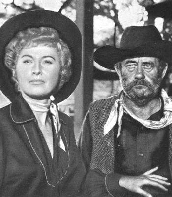 Barbara Stanwyck as Sierra Nevada Jones and Chubby Johnson as Nat Collins in Cattle Queen of Montana (1954)