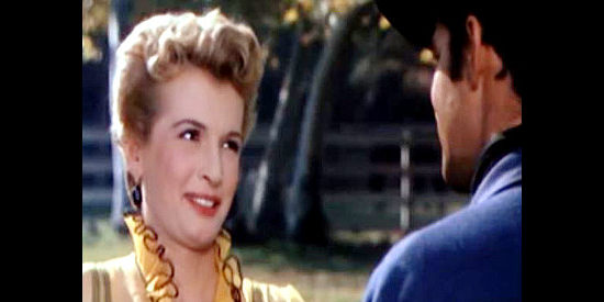 Carole Mathews as Cynthia London, getting acquainted with Brett Stanton in City of Bad Men (1953)