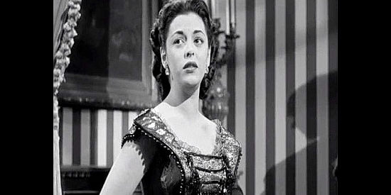 Estelita Rodriguez as Maria Sanchez, singing in the saloon owned by Linc Corey and Mike Prescott and mourning the death of her lover, Bob Martin, in California Passage (1950)