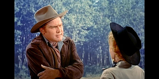 Gene Evans as Tom McCord, working on a deal to buy out Sierra Nevada Jones in Cattle Queen of Montana (1954)