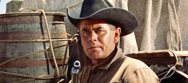 Glenn Ford as Tom Reese, about to try to save the life of a partner he never wanted in Cowboy (1958)