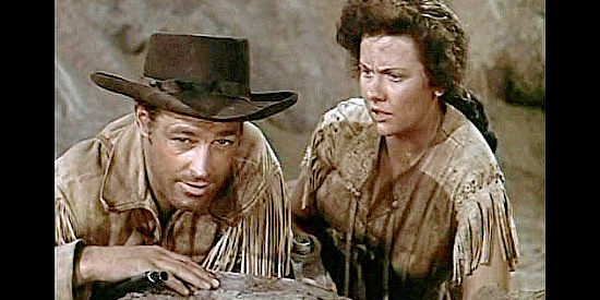 Guy Madison as Miles Archer and Helen Wescott as Ann McKeever as the guardhouse brigade is pinned down by Cheyenne in The Charge at Feather River (1953)