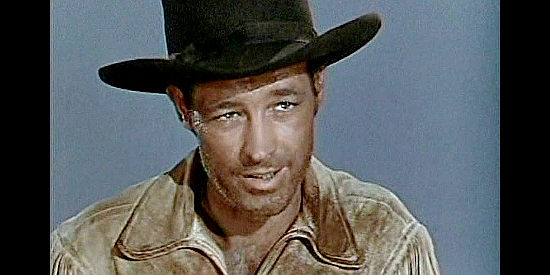 Guy Madison as Miles Archer, the civilian who leads the guardhouse brigade on a rescue mission in The Charge at Feather River (1953)