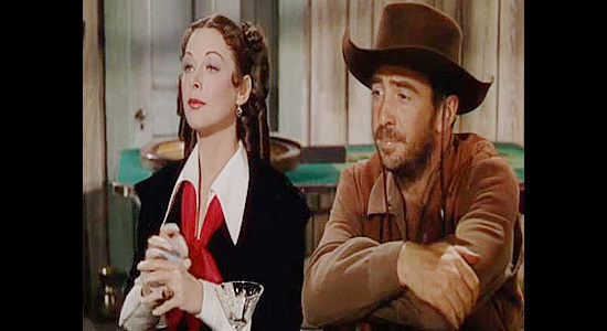 Hedy Lamarr as Lisa Roselle and Macdonald Carey as Lane Travis, frigid partners for the moment in Copper Canyon (1950)