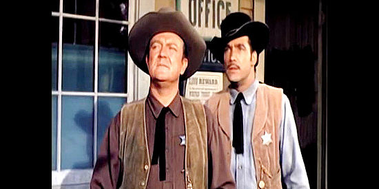 Hugh Sanders as Sheriff Bill Gifford and Deputy Phil Ryan (Carl Betz) watch another bad man ride into Carson City in City of Bad Men (1953)