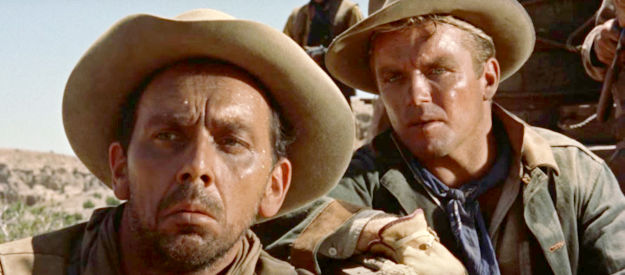 King Donovan as Joe Capper and Richard Jaeckel as Paul Curtis, trail hands waiting for an Indian attack in Cowboy (1958)