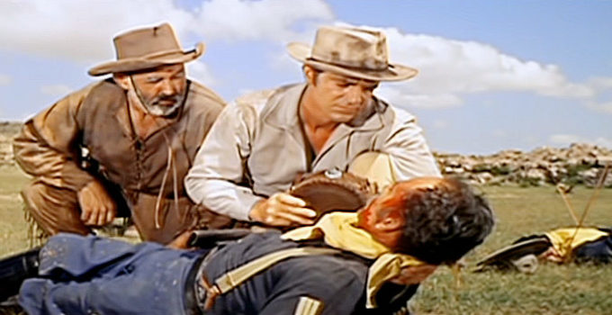 Nestor Paiva as Puffer and Dana Andrews as Jim Read in Comanche (1956)