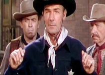 Randolph Scott as Steve Farrell, finding himself under the guns of Jason Brett's men in Colt .45 (1950)