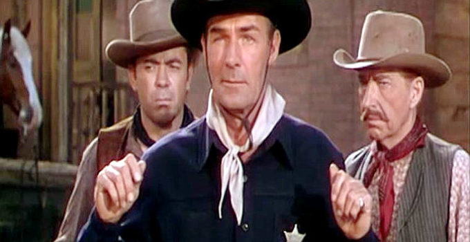 Randolph Scott as Steve Farrell, finding himself under the guns of Jason Brett's men in Colt .45 (1950)