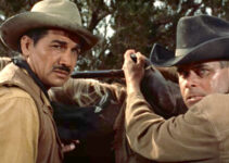 Victor Manuel Mendoza as Paco Mendoza and Glenn Ford as Tom Reese in Cowboy (1958)