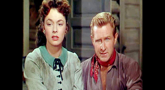 Ruth Roman as Beth Donovan with husband Paul (Lloyd Bridges), who pretends to be in danger from outlaw Jason Brett in Colt .45 (1950)