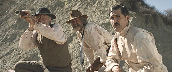 Chicory (Richard Jenkins), Sheriff Franklin Hunt (Kurt Russell) and John Brooder (Matthew Fox) search for cave dwllers in Bone Tomahawk (2015)