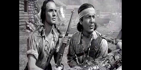 James Mitchell as Red Rock and Robert Taylor as Lance Poole during the attack on Sweet Meadows in Devil's Doorway (1950)