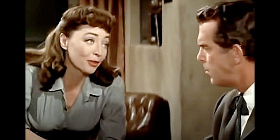 Marie Windsor as Cora Johnson, using her charm to try to save her boyfriend from hanging in Day of the Badman (1958)