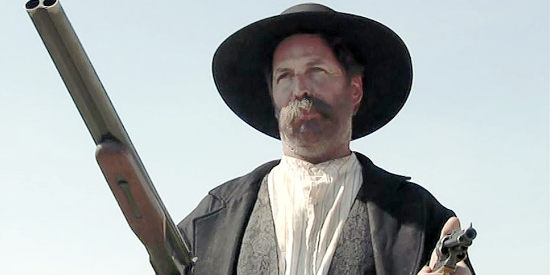Pat McIntire as the Uncle, brandishing shotgun and pistol to rob a stagecoach in Living By the Gun (2011)