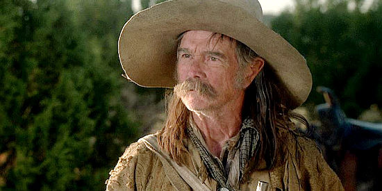 Buck Taylor as Ben Lily, a buffalo hunter sharing news of the raid on Austin in Comanche Moon (2008)