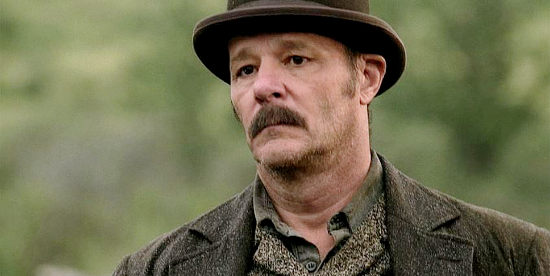 Chris Mulkey as Ed Big Ears Bywaters, the outlaw Big Rump Kate hires to recover the girls she considers her property in Broken Trail (2006)