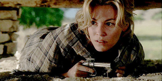 Elizabeth Banks as Maggie, hiding during the Comanche attack on Austin in Comanche Moon (2008)