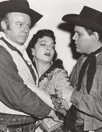 Alan Hale Jr. as the Sundance Kid, Lillian Molieri as Rita Aguilar and Neville Brand as Butch Cassidy in The Three Outlaws (1956)