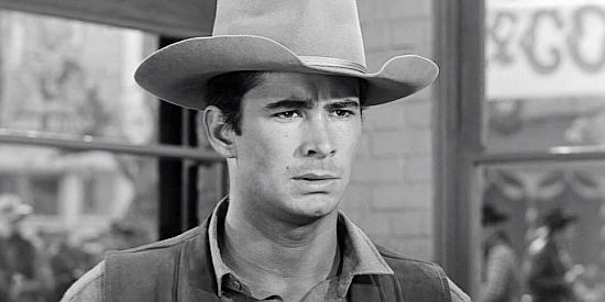 Anthony Perkins as Ben Owens, a young man determined to prove he can handle a sheriff's badge in The Tin Star (1957)