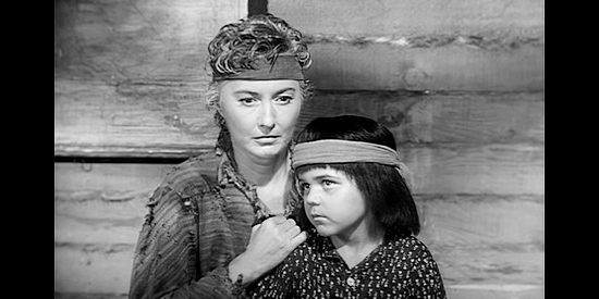 Barbara Stanwyck as Cora Sutliff with her song Quito (Terry Lawrence) in Trooper Hook (1957)