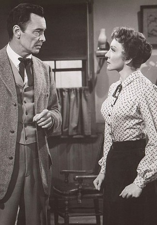 Barry Sullivan as Chris Mooney and Claudette Colbert as Prudence Webb in Texas Lady (1955)