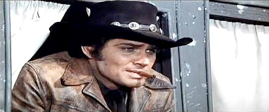 Brett Halsey as Roy Colt surprises an old friend when he reveals his new job in Roy Colt and Winchester Jack (1970)