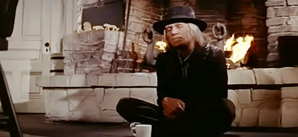 Carl 'Alfalfa' Switzer as Joe Sam, an old-timer warming himself by the Bridges' family fireplace in Track of the Cat (1954)