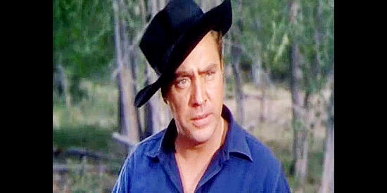 Edmond O'Brien as Jim Vesser, questioning Linda Prescott about her afternoon rides in The Denver and Rio Grande (1952)