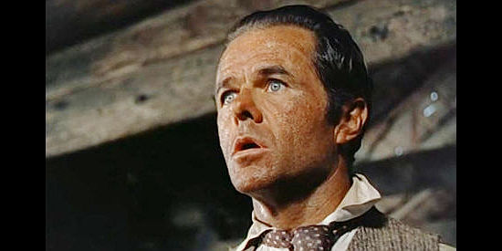 Elisha Cook Jr. as Joseph Standish, a tax collector fearful for his life after witnessing a murder in Thunder Over the Plains (1953)