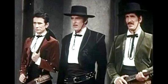 Gianni Solar as Gonzalez, flanked by his relatives in Five Giants from Texas (1966)