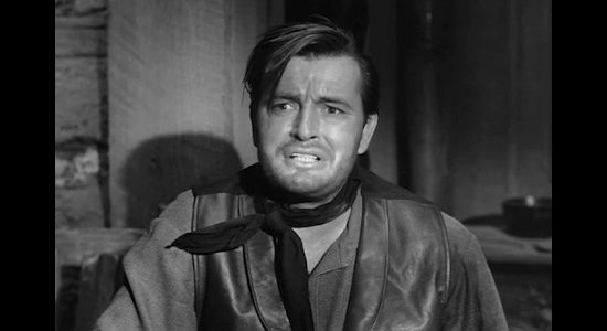 Gregg Palmer as Brad Santley, refusing to believe he's been double-crossed by his own brother in Gun Fight (1961)